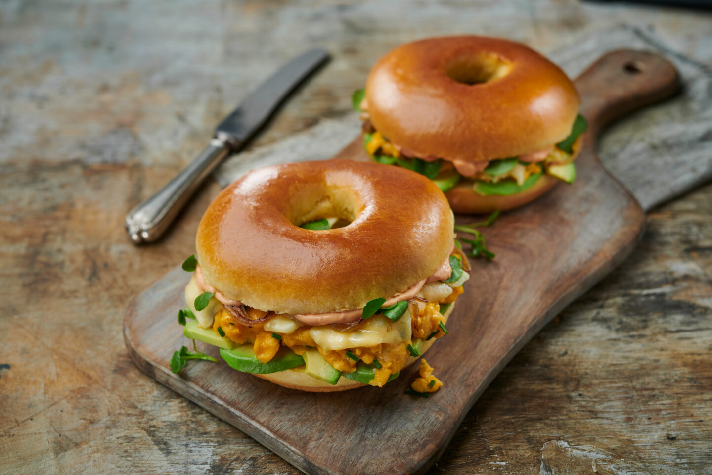 St Pierre Egg And Avocado Brioche Bagels On A Cutting Board