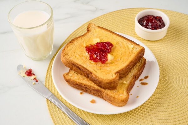 Croissant Loaf Toast Slice on Plate With Jam & Butter