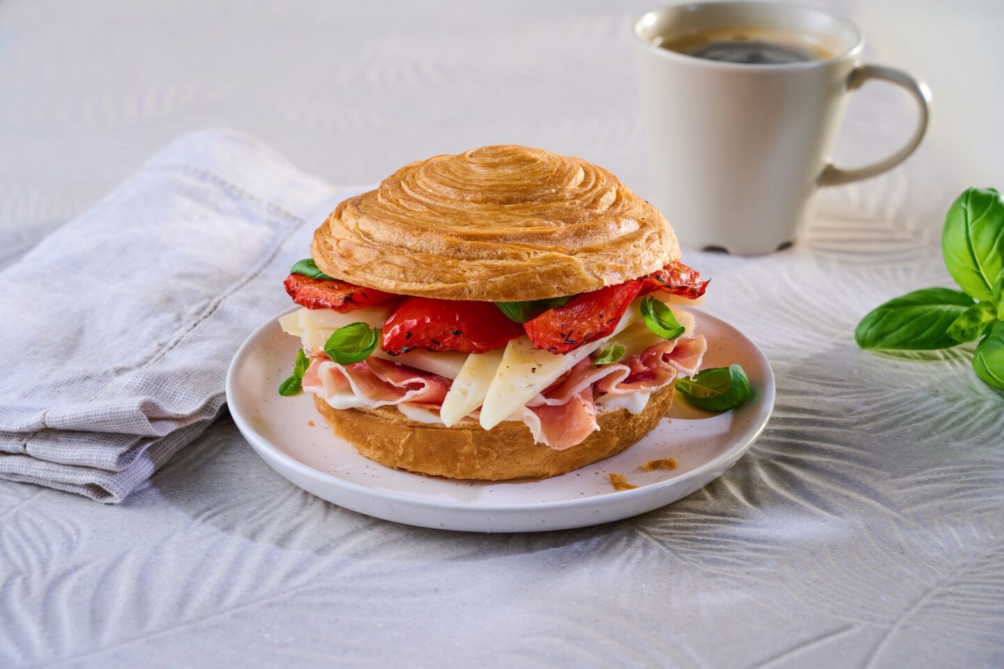 Croissant Roll with Serrano, Manchego & Roasted Peppers