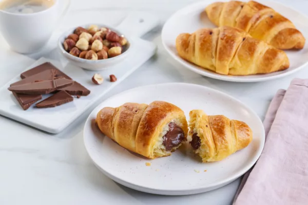 Chocolate & Hazelnut Filled Croissants On Plates